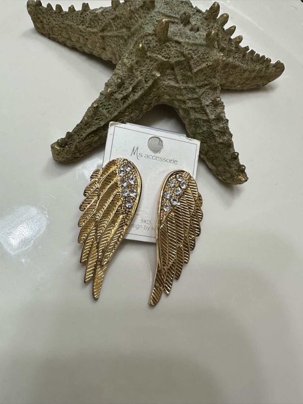 Angel wings earrings gold tone